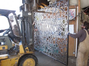 Handmade metal gate created from recycled metal rings