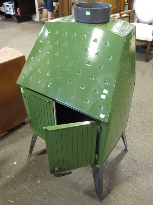 Photo of olive green woodburning stove in the Danish Modern style