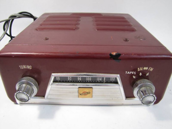 Picture of an old maroon Chrystler car stereo