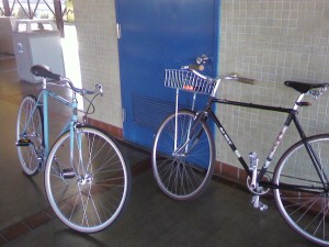 Photo of two bicycles at a Bart Station.